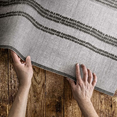 Műanyag szőnyeg Szürke a boho vonalakban szövet utánzat