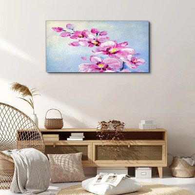 Vászonkép Rózsaszín orchideák kék alapon
