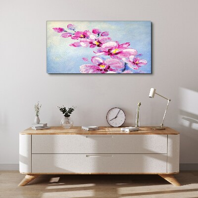 Vászonkép Rózsaszín orchideák kék alapon