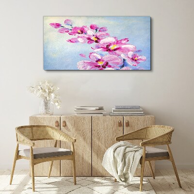 Vászonkép Rózsaszín orchideák kék alapon