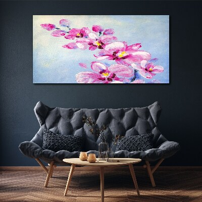 Vászonkép Rózsaszín orchideák kék alapon