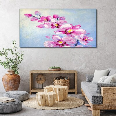 Vászonkép Rózsaszín orchideák kék alapon