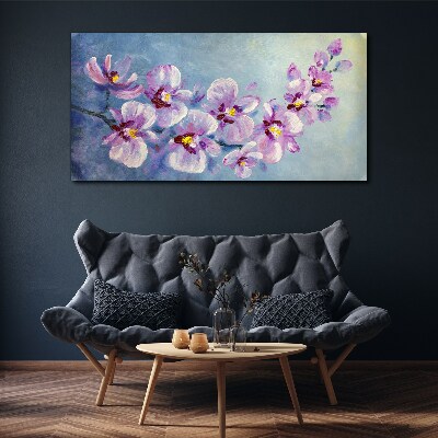 Vászonkép Virágos orchideák a kék háttér