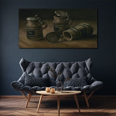 Vászonkép Antik bögrék az asztalon