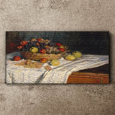 Vászonkép Gyümölcskosár fehér terítőn