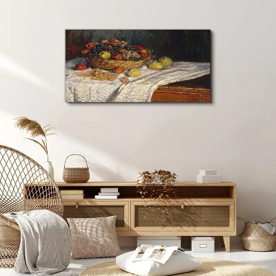 Vászonkép Gyümölcskosár fehér terítőn