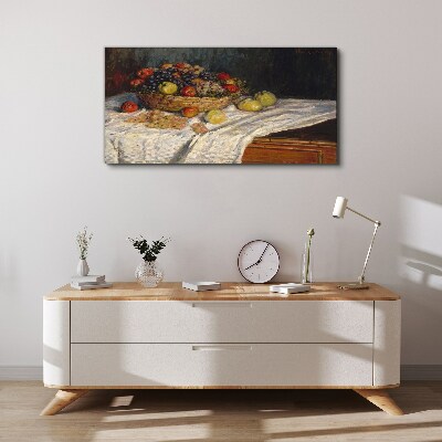 Vászonkép Gyümölcskosár fehér terítőn