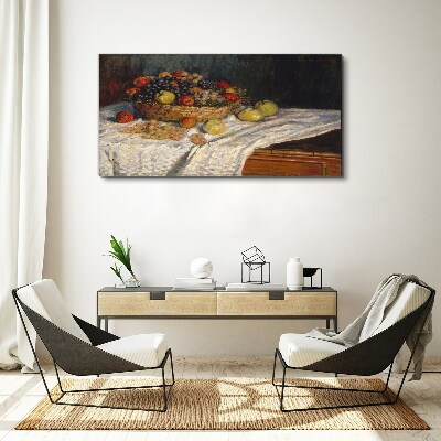 Vászonkép Gyümölcskosár fehér terítőn