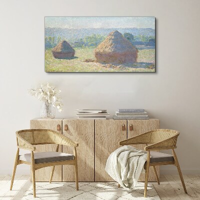 Vászonkép Nyári nap a szénakazalok felett