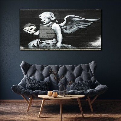 Vászonkép Angyal egy koponyával a graffiti háttérben