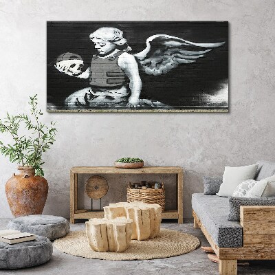 Vászonkép Angyal egy koponyával a graffiti háttérben