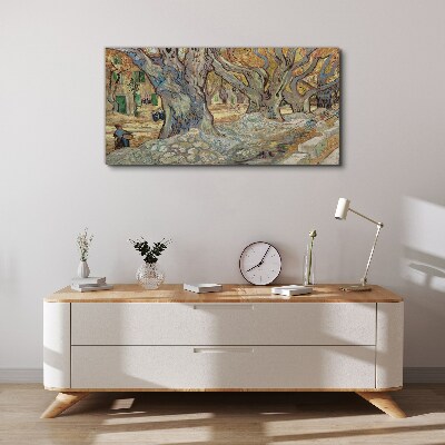 Vászonkép Fákkal szegélyezett utca tavaszi napsütésben