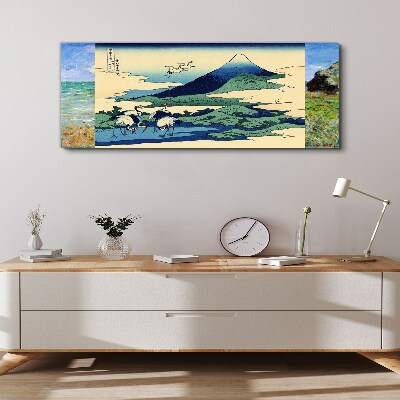 Vászonkép Daruk egy hegy mellett