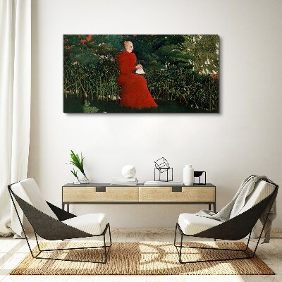 Vászonkép Piros kabát a kertben