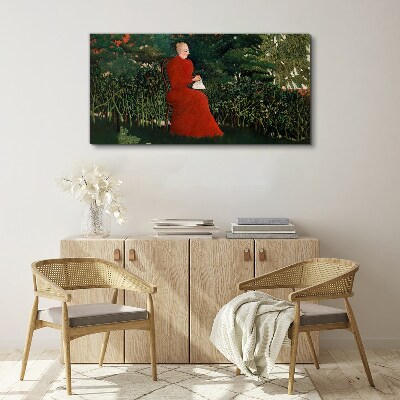 Vászonkép Piros kabát a kertben