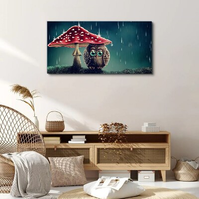 Vászonkép Egy bagoly egy gomba alatt az esőben