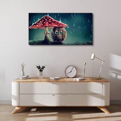 Vászonkép Egy bagoly egy gomba alatt az esőben