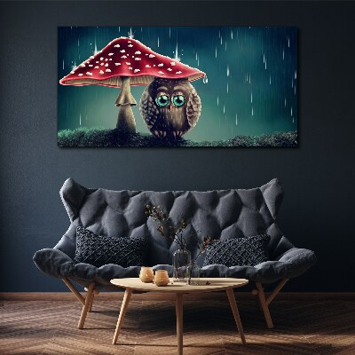Vászonkép Egy bagoly egy gomba alatt az esőben