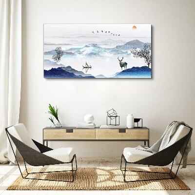 Vászonkép Békés hegyi táj egy szarvassal