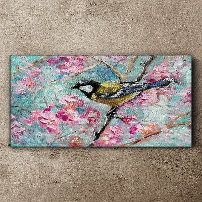 Vászonkép Tavaszi madár énekel egy ágon