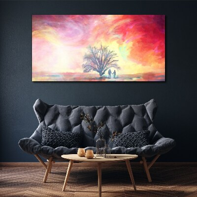 Vászonkép Romantikus naplemente a fa alatt