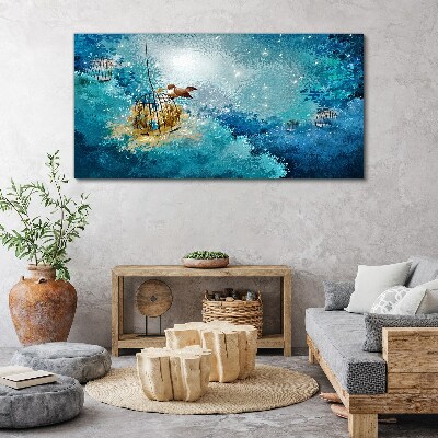 Vászonkép Egy ketrecbe zárt madár az égen