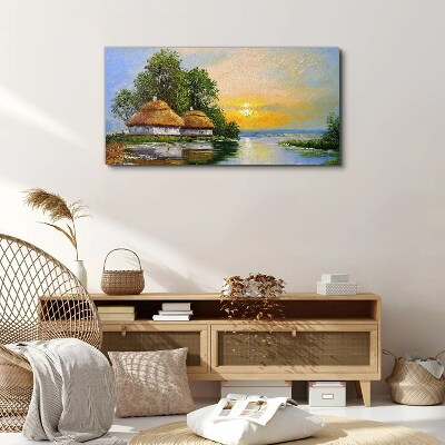 Vászonkép Békés naplemente a falu felett