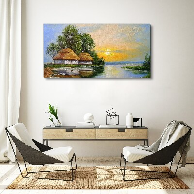 Vászonkép Békés naplemente a falu felett