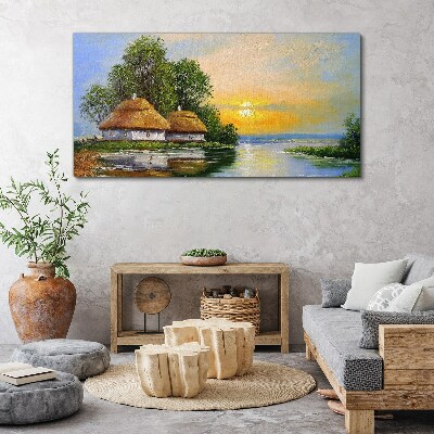 Vászonkép Békés naplemente a falu felett