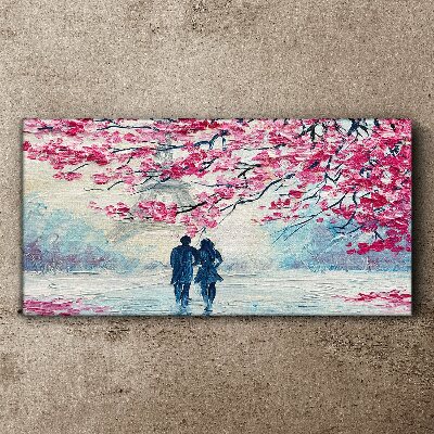 Vászonkép Tavaszi séta a virágzó fák alatt