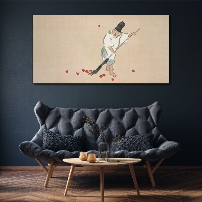 Vászonkép Szerzetes tisztítás levelekkel