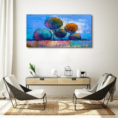 Vászonkép Színes fák kék alapon