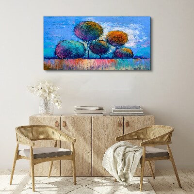 Vászonkép Színes fák kék alapon
