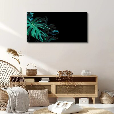 Vászonkép Zöld levelek fekete alapon