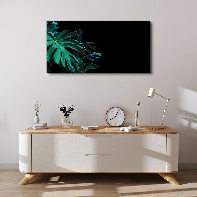 Vászonkép Zöld levelek fekete alapon