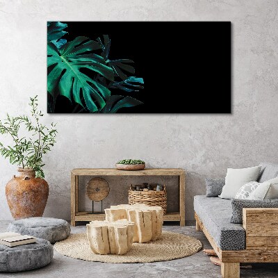 Vászonkép Zöld levelek fekete alapon