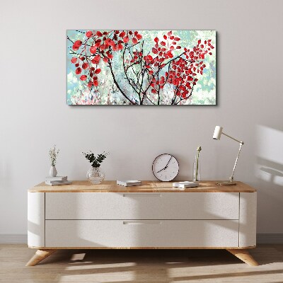 Vászonkép Piros levelek kék alapon