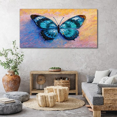 Vászonkép Kék pillangó pasztell háttérrel