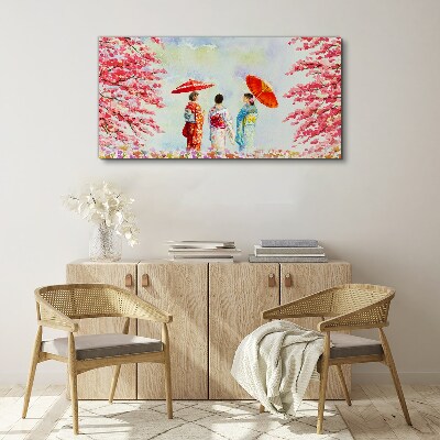 Vászonkép Tavaszi séta a virágzó fák alatt