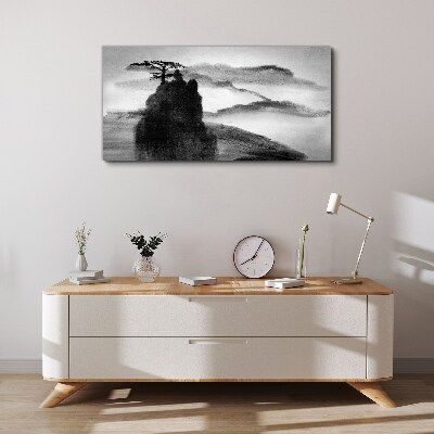 Vászonkép Egy magányos fa egy sziklás hegyen