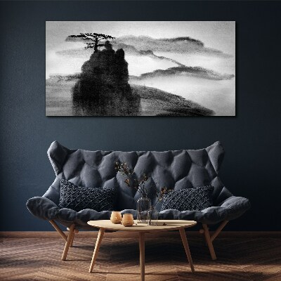 Vászonkép Egy magányos fa egy sziklás hegyen