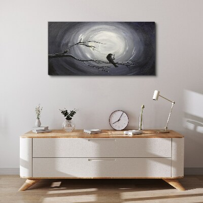 Vászonkép Egy magányos madár egy ágon