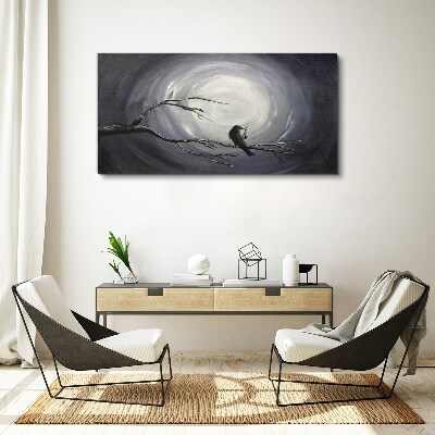 Vászonkép Egy magányos madár egy ágon