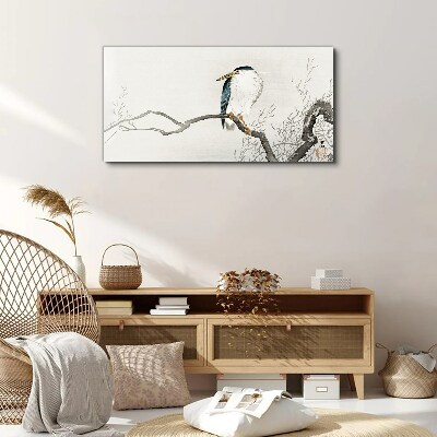 Vászonkép Egy madár egy ágon egy finom tájon