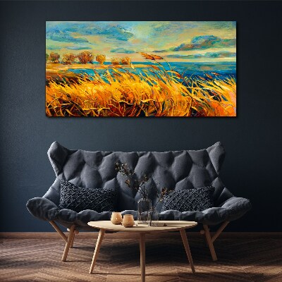 Vászonkép Arany fű kék ​​víz felett