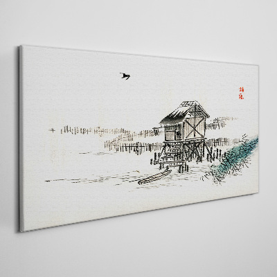 Vászonkép Csendes házikó a víz mellett