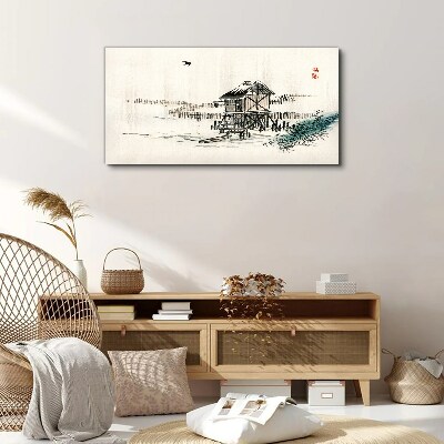 Vászonkép Csendes házikó a víz mellett