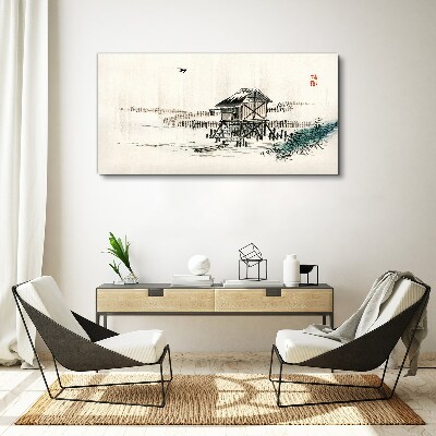 Vászonkép Csendes házikó a víz mellett