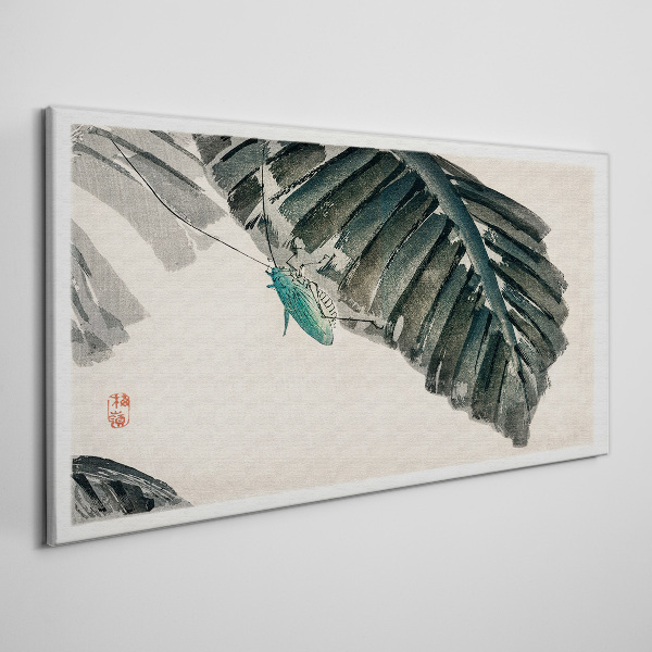 Vászonkép Egy karcsú rovar a leveleken