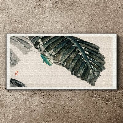 Vászonkép Egy karcsú rovar a leveleken